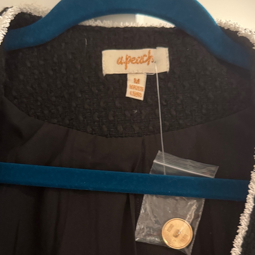 a peach Black jacket with White Trim - Picture 2 of 3